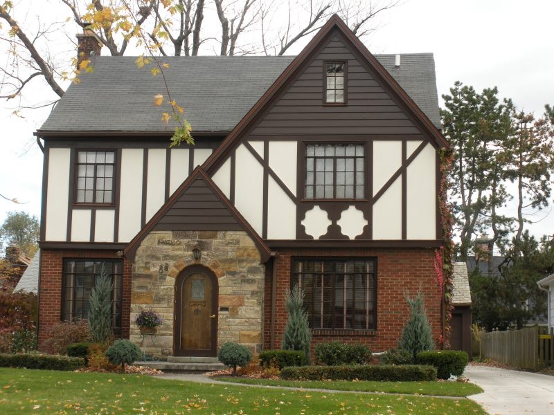 Facade of a country house with combined decoration