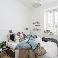 Decorative pillows on the bed in a bright bedroom