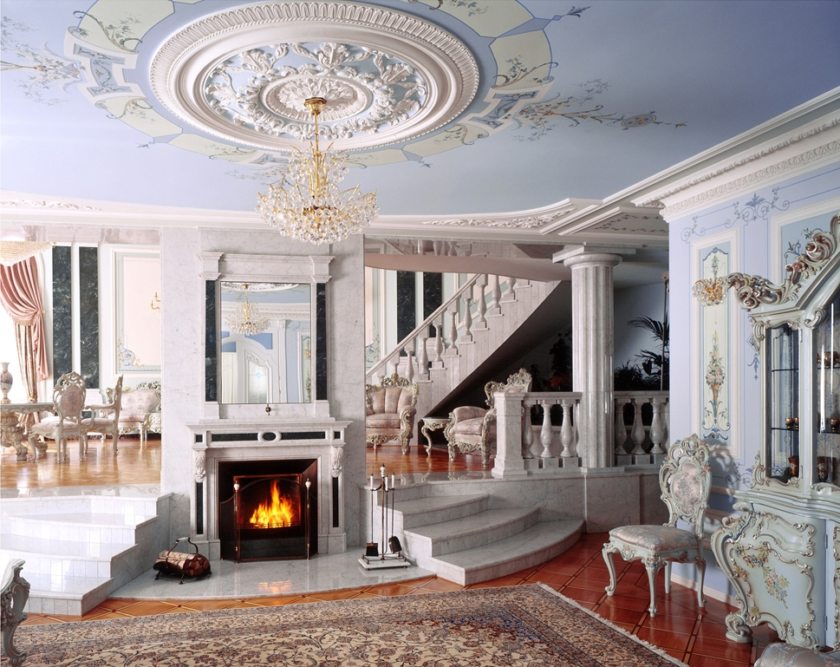 Large plaster outlet on the ceiling of the hall in a country house