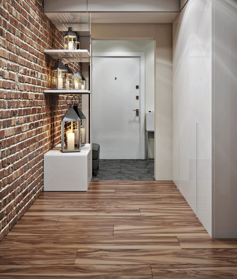 Narrow entryway with brick wall