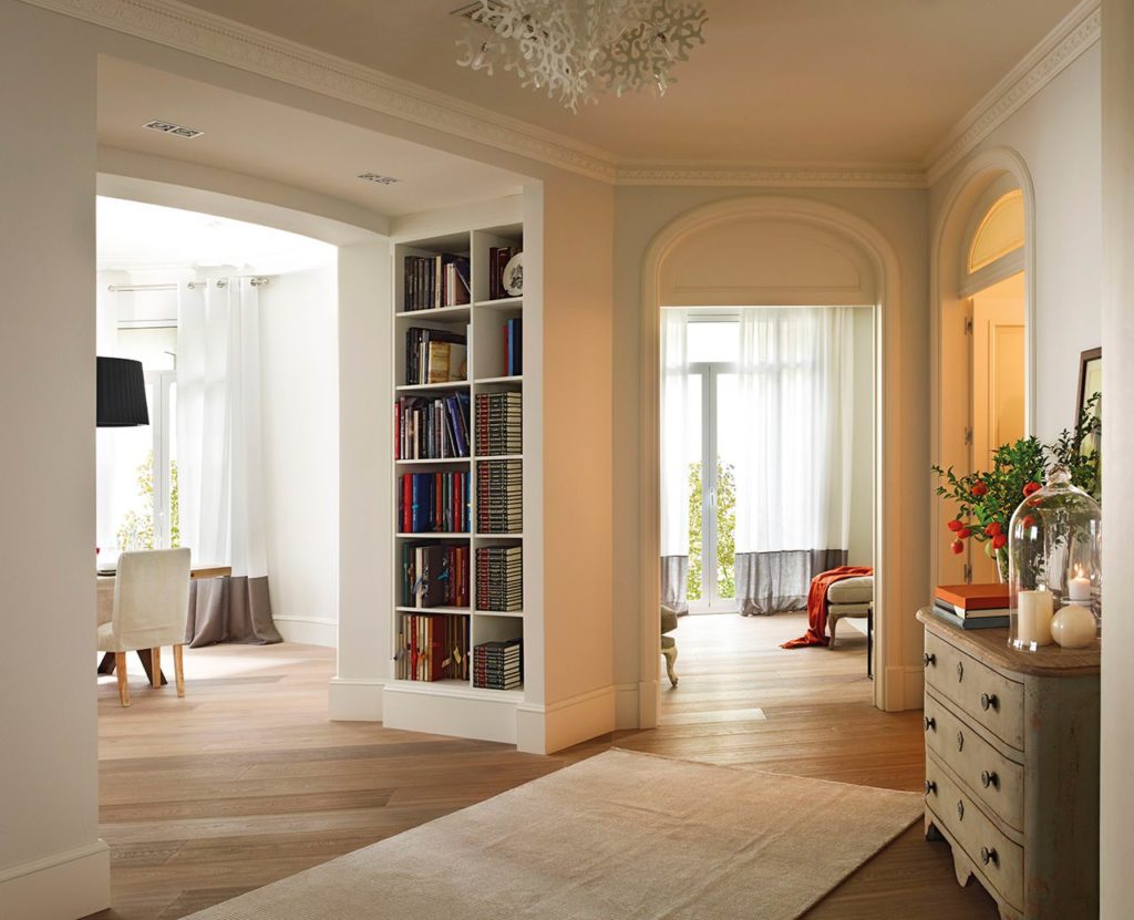 Built-in bookshelves between two rooms