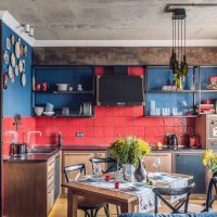 Open shelves with utensils on a background of blue walls