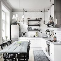 Dining table made of boards in a bright kitchen