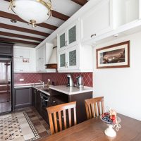 Tiled floor in L-shaped kitchen