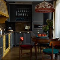 The interior of the modern kitchen in dark shades