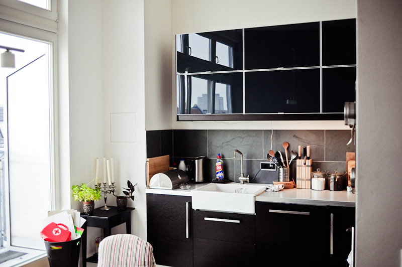 Small kitchen with black furniture