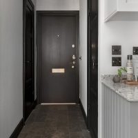 Interior of a narrow corridor with laminate flooring