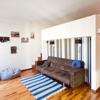 Striped carpet on wooden floor