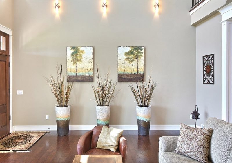 Three floor vases in the living room of a city apartment