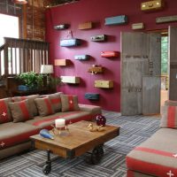 Old suitcases on the red wall of the living room