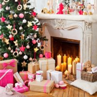 Holiday candles in the fireplace of a private house