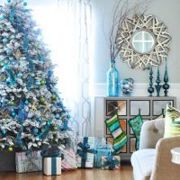 Boxes with presents under an elegant Christmas tree