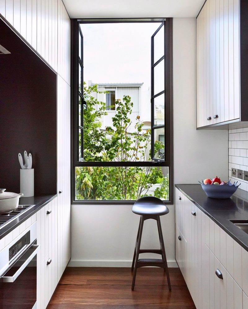 Black bar stool on brown floor