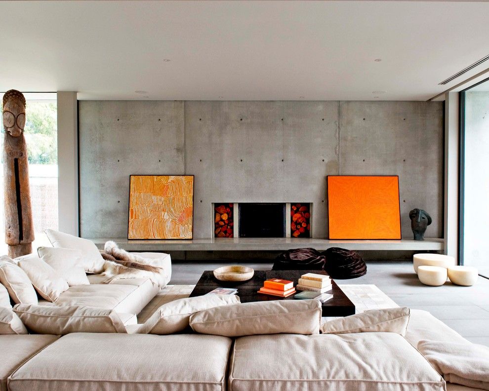 Orange accents on a gray concrete wall background.