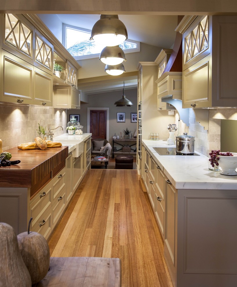 Three ceiling lights in a long kitchen