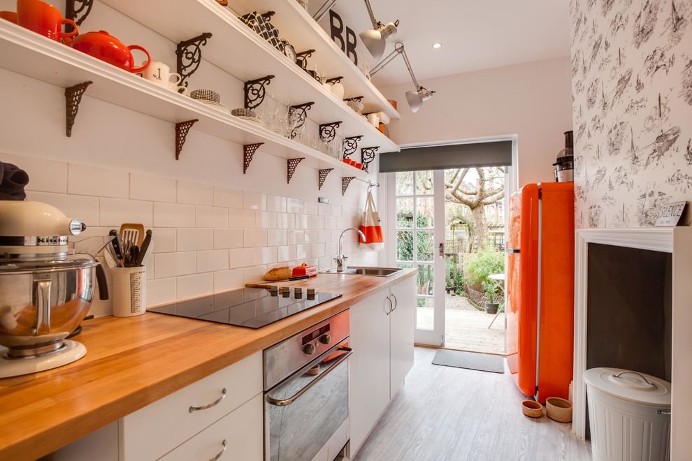 wooden open shelves in a narrow kitchen