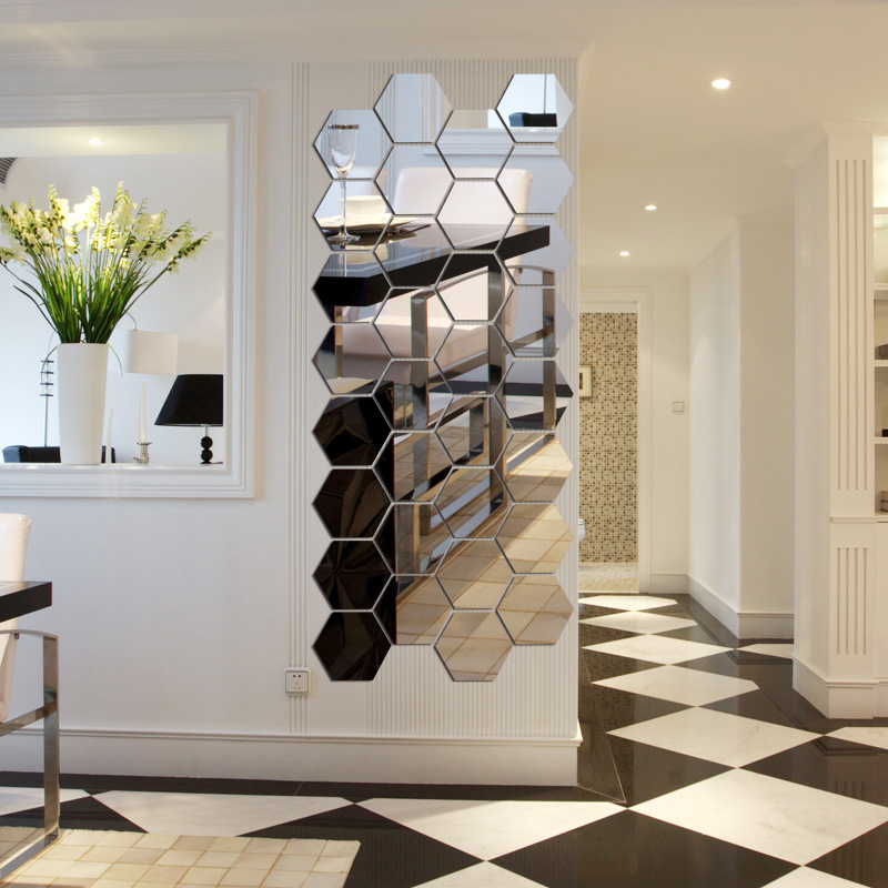 Mirror composition of tiles in the form of honeycombs on the wall of the hallway