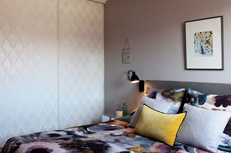 Decorative pillows on the bed in a panel house