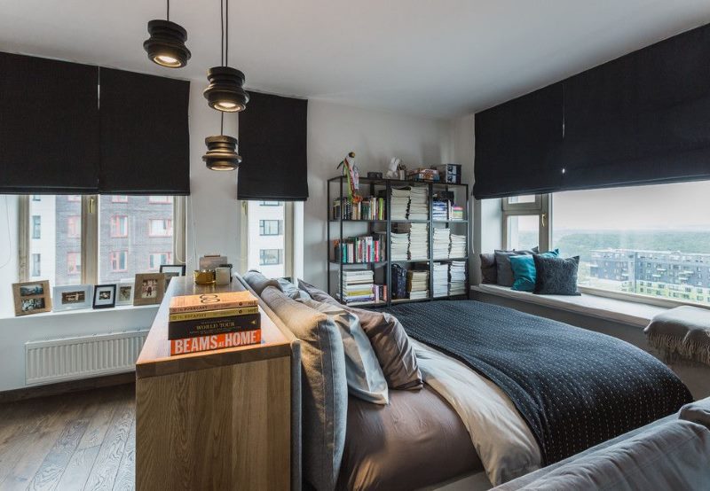 Bedroom interior for a young man with black curtains