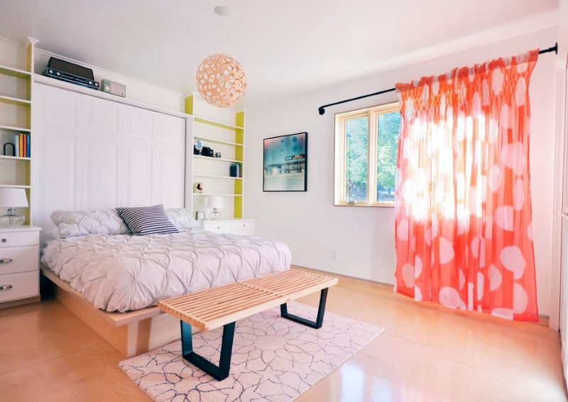 Pink curtains in the bedroom interior