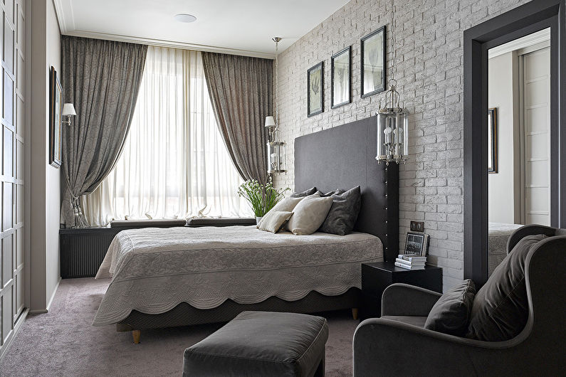 Design of a gray bedroom in a two-bedroom apartment