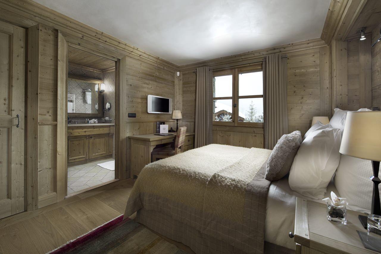 Gray bedroom ceiling with wood trim