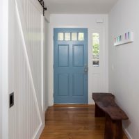 Wooden bench in front of the front door