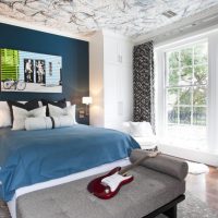 Dark blue wall in the bedroom interior