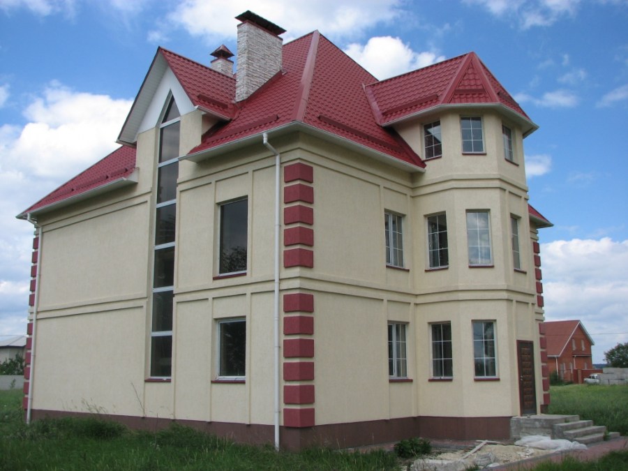 Two-storey house with an attic and a painted facade