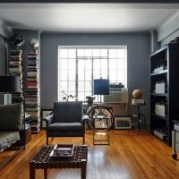 Brown floor in a room with dark walls