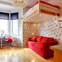 Hanging bed over a red sofa