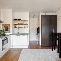 Open shelves with dishes over the kitchen sink