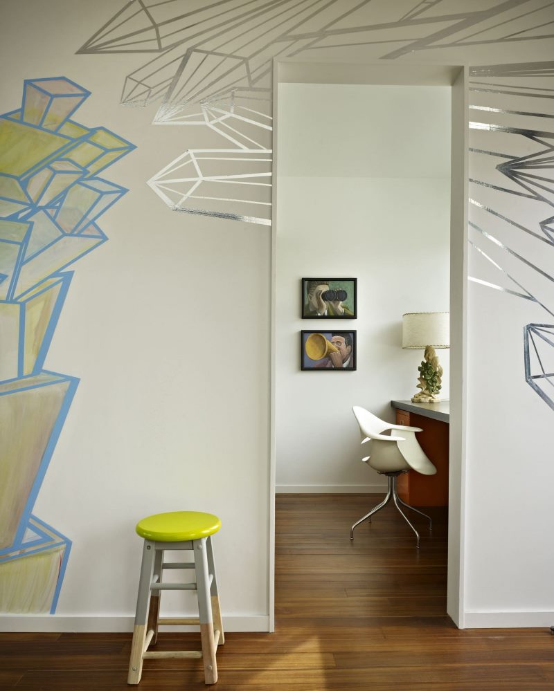 Stool with round seat against the wall in a two-bedroom apartment