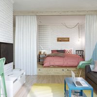 Bed on the podium in a three-room apartment