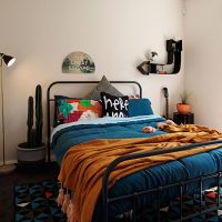 Bed on a metal frame in the small bedroom