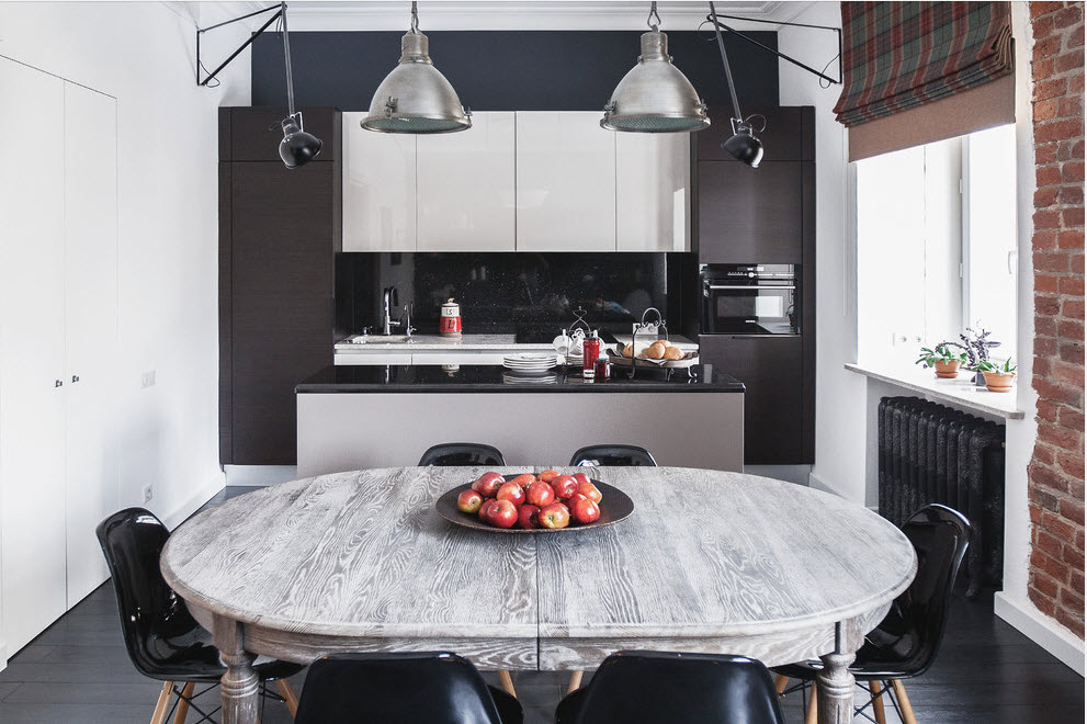 White cabinets on a black kitchen wall