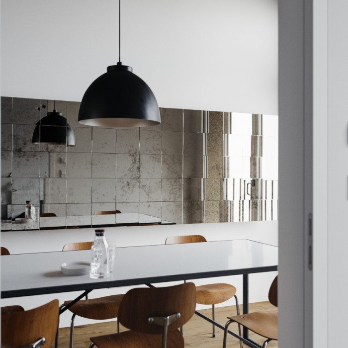 Decorative wall decoration of the kitchen with mirror tiles