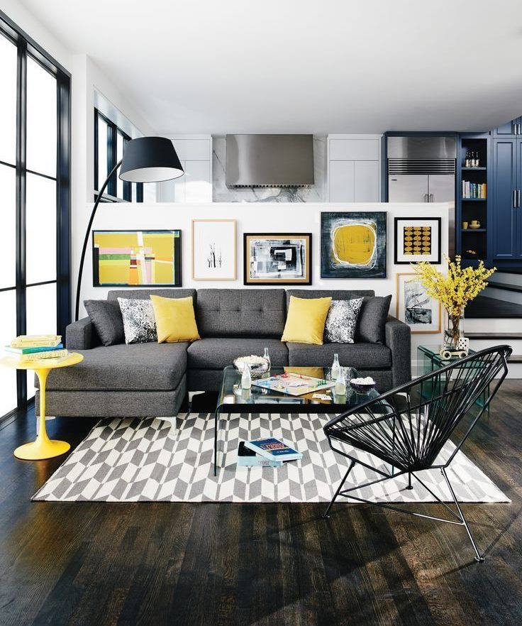 Light yellow pillows on a gray sofa in the living room