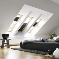 Black bed under the dormers