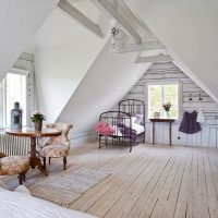 Round wooden table on a curly leg