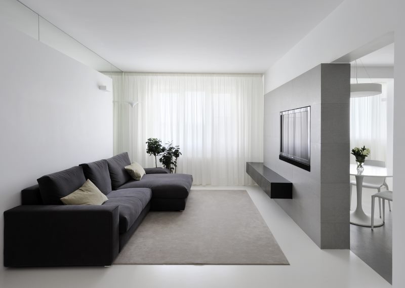 Black sofa in a minimalist style living room