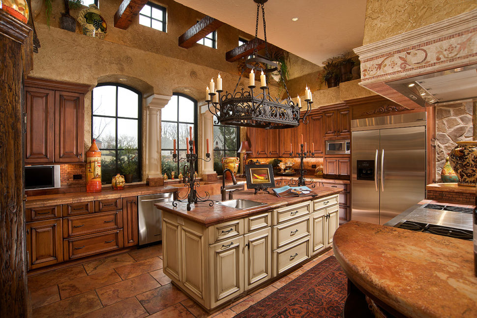 Large wrought iron chandelier over the kitchen island