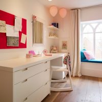 Two pink balloons under the white ceiling