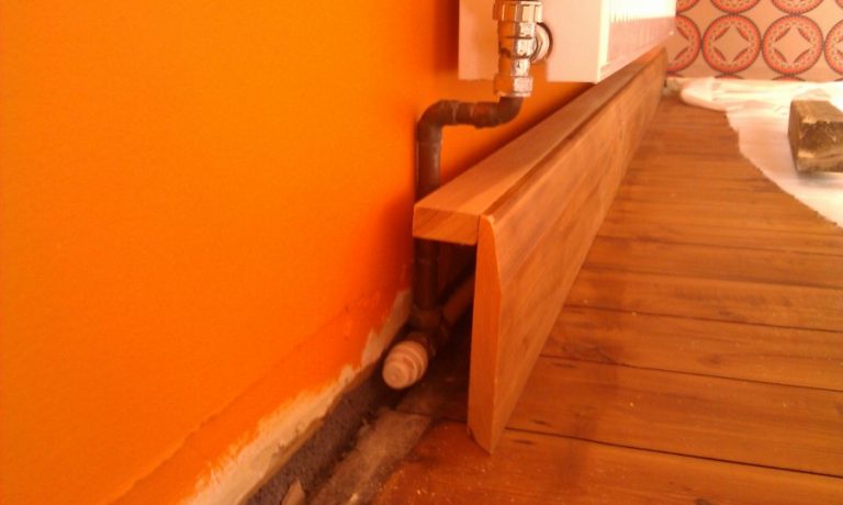 Masking heating pipes in a wooden box