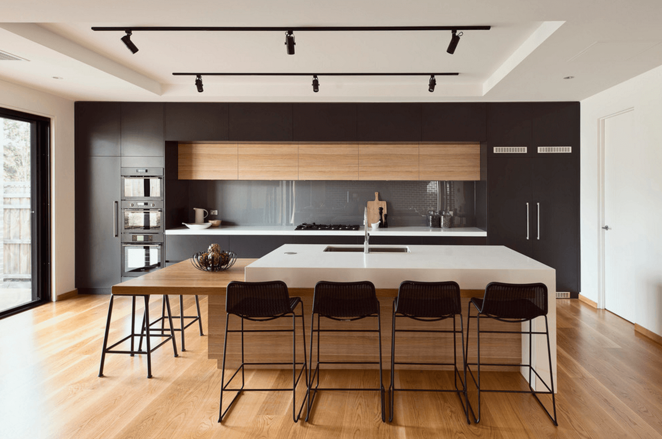 Black spotlights on a white kitchen ceiling