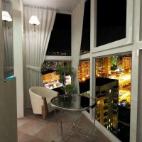 Balcony with windows to the floor in a modern apartment