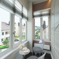 Plastic chairs in a narrow balcony