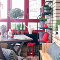 Red frames on the balcony of a high-rise building