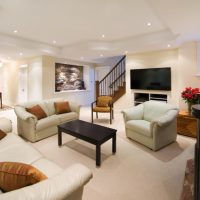 Spotlights on the ceiling of the living room with stairs