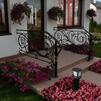 Porch with wrought iron railing in a private house.